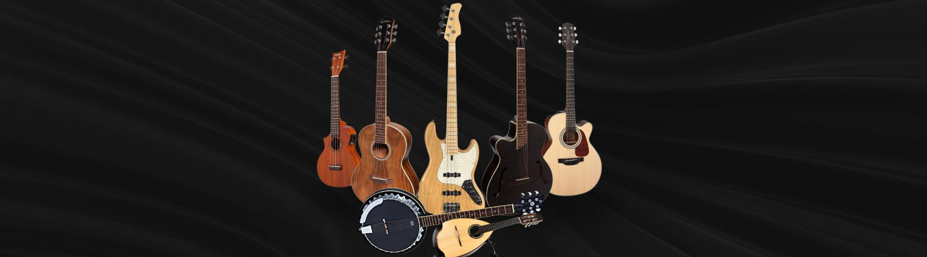 Guitars and Bass instruments at Music Man music store
