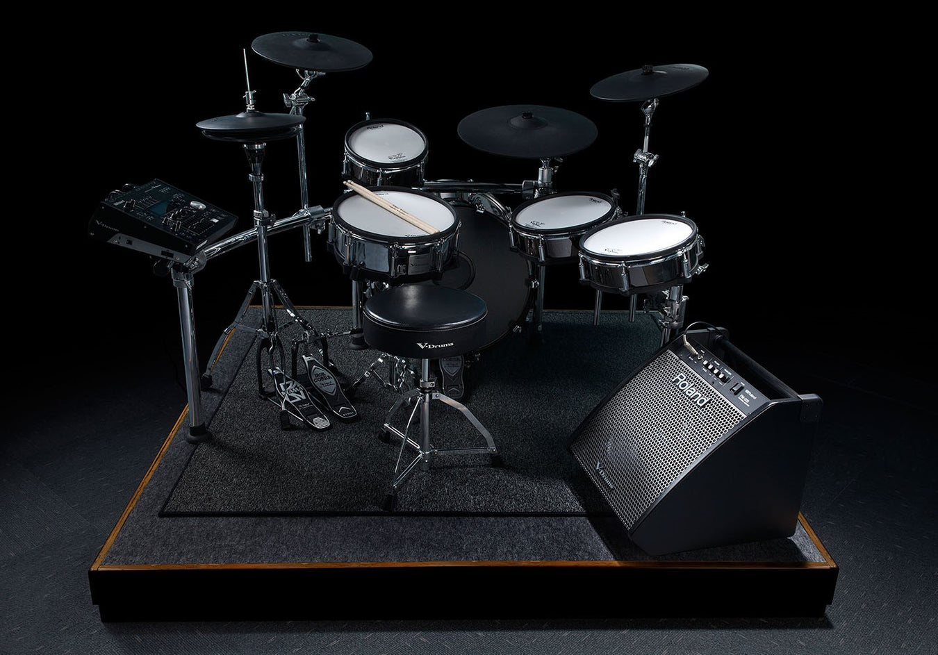Studio photograph of a drum set