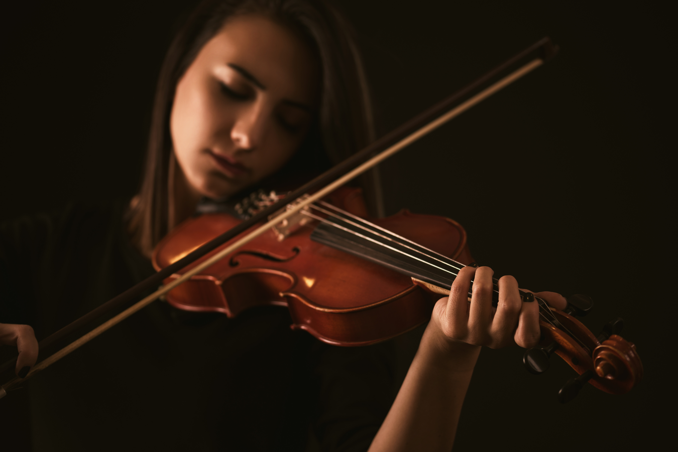 Music student playing the violin